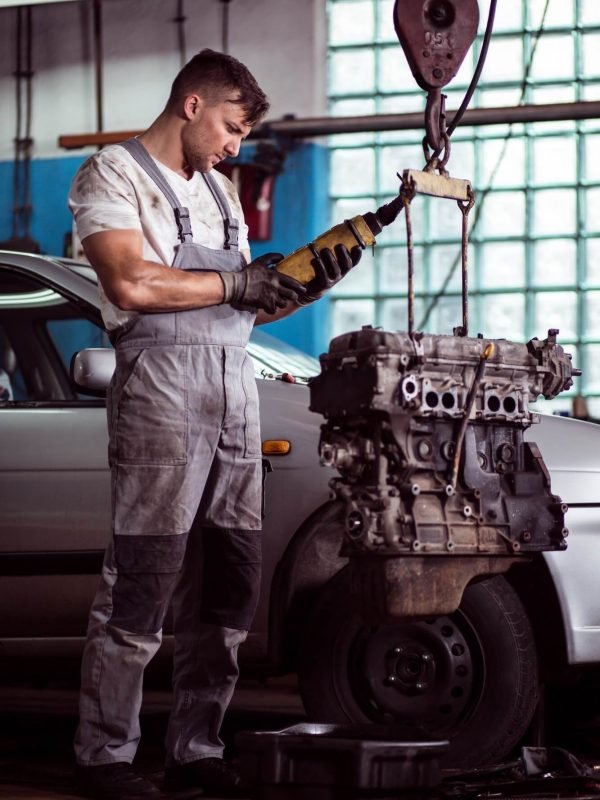 auto-mechanic-inspecting-motor-car-1.jpg