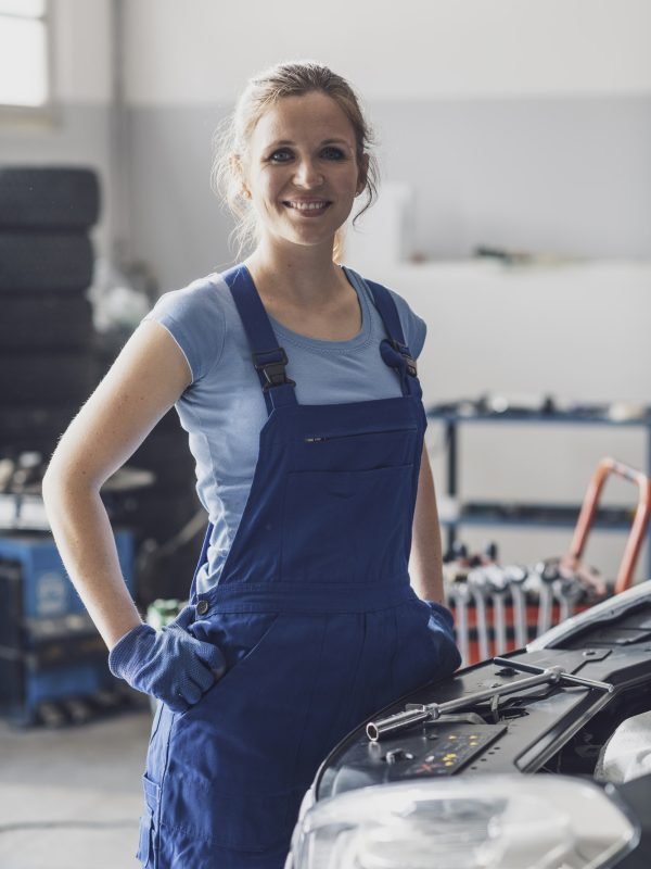 confident-female-mechanic-posing-in-the-auto-repair-shop.jpg