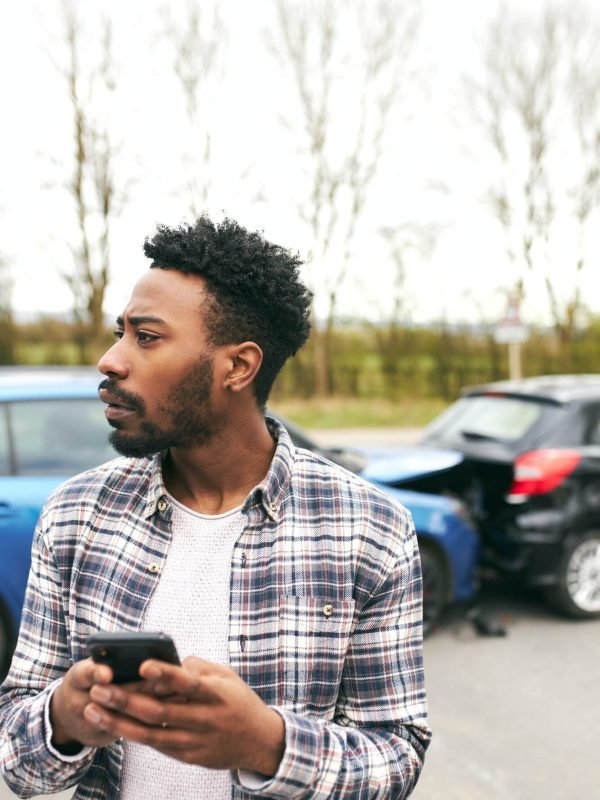 young-male-driver-calling-car-breakdown-recovery-company-on-mobile-phone-after-road-traffic-accident-1.jpg